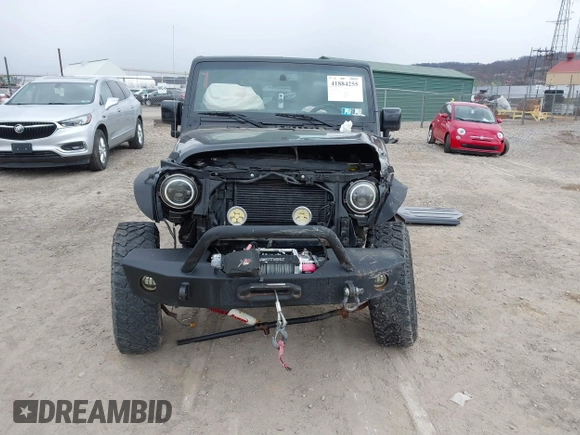 2014 Jeep Wrangler Sahara with VIN 1C4AJWBG9EL311477, listed as a IAAI auction lot 41884255 with 82,221 mi miles and . Bid and sale history available at carsss.com. Image 13.