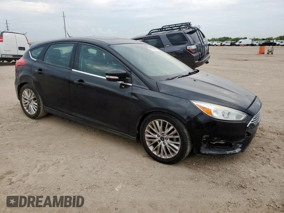 2018 Ford Focus Titanium z VIN 1FADP3N2XJL289659, wystawiony jako Copart lot #65594275 z przebiegiem 115 739 mil mil oraz Czysty tytuł • Clean title. Historia ofert i sprzedaży dostępna na DreamBid. Obrazek 4.