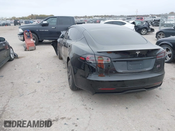 2022 Tesla Model S Plaid with VIN 5YJSA1E65NF484149, listed as a IAAI auction lot 40937538 with 11,459 mi miles and . Bid and sale history available at DreamBid. Image 3.