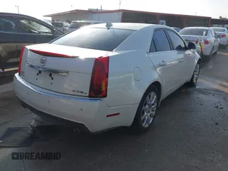 2009 Cadillac CTS AWD z VIN 1G6DT57VX90140080, wystawiony jako IAAI lot #41802817 z przebiegiem 146 978 mil mil oraz . Historia ofert i sprzedaży dostępna na DreamBid. Obrazek 4.