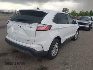 2024 Ford Edge SEL z VIN 2FMPK4J90RBA77889, wystawiony jako IAAI lot #42484303 z przebiegiem 51 211 mil mil oraz . Historia ofert i sprzedaży dostępna na DreamBid. Obrazek 4.