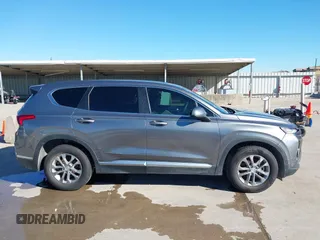 2019 Hyundai Santa Fe SE z VIN 5NMS23AD9KH037539, wystawiony jako IAAI lot #42221894 z przebiegiem 87 755 mil mil oraz . Historia ofert i sprzedaży dostępna na DreamBid. Obrazek 13.