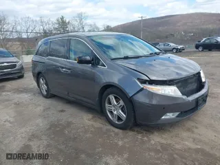 2012 Honda Odyssey Touring with VIN 5FNRL5H96CB071255, listed as a IAAI auction lot 41959312 with 167,620 mi miles. Bid and sale history available at carsss.com. Image 1.
