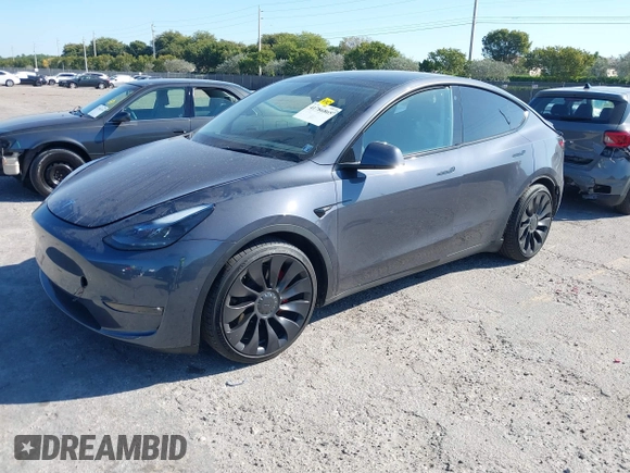 2022 Tesla Model Y Performance with VIN 7SAYGDEF6NF540094, listed as a IAAI auction lot 41786865 with 28,356 mi miles and . Bid and sale history available at DreamBid. Image 2.