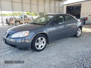 2009 Pontiac G6 1SA with VIN 1G2ZG57B694156559, listed as a Copart auction lot 63328575 with 154,944 mi miles and Salvage title. Bid and sale history available at DreamBid. Image 1.