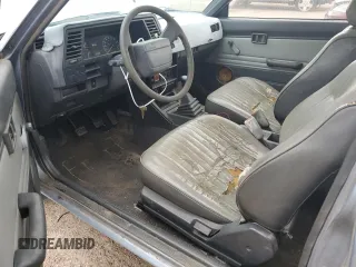 1987 Nissan Sentra z VIN JN1PB2210HU557007, wystawiony jako Copart lot #68174784 z przebiegiem 150 316 mil mil oraz Tytuł czysty. Historia ofert i sprzedaży dostępna na DreamBid. Obrazek 8.