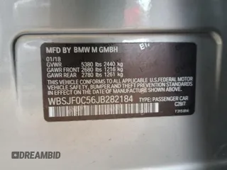 2018 BMW M5 z VIN WBSJF0C56JB282184, wystawiony jako Copart lot #87480414 z przebiegiem Nie podano mil oraz Szkody całkowita. Historia ofert i sprzedaży dostępna na DreamBid. Obrazek 12.