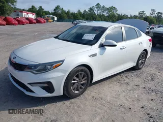 2020 Kia Optima LX with VIN 5XXGT4L30LG390927, listed as a IAAI auction lot 42642424 with 84,697 mi miles and . Bid and sale history available at DreamBid. Image 2.