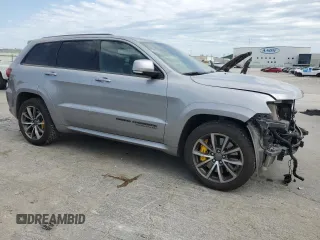 2018 Jeep Grand Cherokee Trackhawk with VIN 1C4RJFN91JC223825, listed as a Copart auction lot 58011465 with 83,177 mi miles and Salvage title. Bid and sale history available at DreamBid. Image 4.