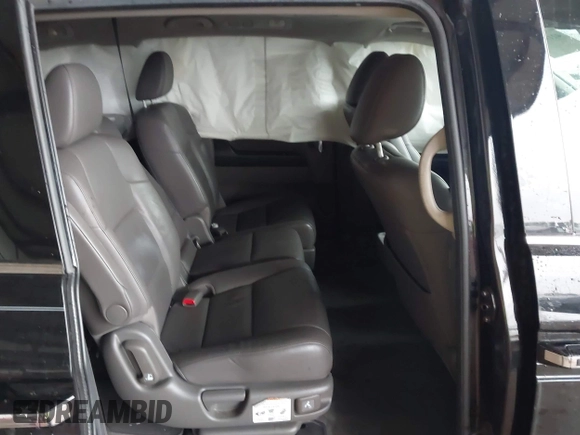 2014 Honda Odyssey Touring with VIN 5FNRL5H98EB095835, listed as a IAAI auction lot 42153412 with 124,131 mi miles and . Bid and sale history available at DreamBid. Image 8.