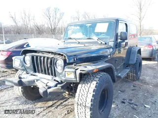 2004 Jeep Wrangler Sport with VIN 1J4FA49SX4P793320, listed as a IAAI auction lot 41246636 with 243,139 mi miles. Bid and sale history available at carsss.com. Image 17.