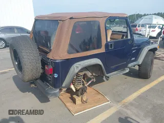2002 Jeep Wrangler Sport with VIN 1J4FA49S72P729703, listed as a IAAI auction lot 42468446 with 164,342 mi miles and . Bid and sale history available at DreamBid. Image 4.