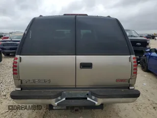 1999 GMC Yukon with VIN 1GKEK13R5XJ767903, listed as a Copart auction lot 84158844 with 112,229 mi miles and Salvage Title. Bid and sale history available at carsss.com. Image 6.
