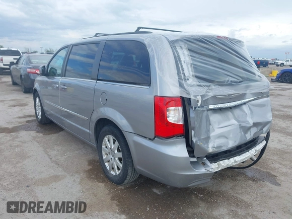 2016 Chrysler Town & Country Touring with VIN 2C4RC1BG0GR213058, listed as a IAAI auction lot 41910462 with 125,013 mi miles and . Bid and sale history available at DreamBid. Image 3.