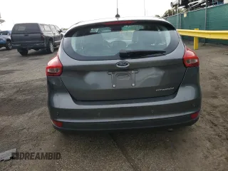 2016 Ford Focus Titanium z VIN 1FADP3N27GL329026, wystawiony jako Copart lot #60910475 z przebiegiem 98 794 mil mil oraz Szkoda całkowita • Salvage title. Historia ofert i sprzedaży dostępna na DreamBid. Obrazek 6.