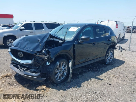 2020 Mazda CX-5 Grand Touring with VIN JM3KFADM9L1837183, listed as a IAAI auction lot 42340628 with 81,975 mi miles and . Bid and sale history available at DreamBid. Image 19.