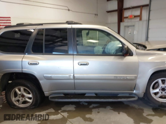 2003 GMC Envoy SLT z VIN 1GKDS13S932299354, wystawiony jako IAAI lot #41238557 z przebiegiem 251 535 mil mil oraz . Historia ofert i sprzedaży dostępna na DreamBid. Obrazek 14.