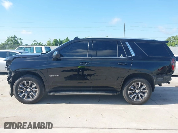 2023 Chevrolet Tahoe LT z VIN 1GNSCNKDXPR477061, wystawiony jako IAAI lot #42225743 z przebiegiem 57 077 mil mil oraz . Historia ofert i sprzedaży dostępna na DreamBid. Obrazek 14.