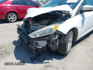 2016 Ford Focus SE z VIN 1FADP3F23GL338496, wystawiony jako IAAI lot #42333608 z przebiegiem 76 972 mil mil oraz . Historia ofert i sprzedaży dostępna na DreamBid. Obrazek 6.