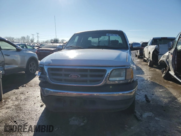 2002 Ford F-150 XL with VIN 1FTRX17L52NA26169, listed as a Copart auction lot 88756715 with 114,841 mi miles and Salvage title. Bid and sale history available at DreamBid. Image 5.