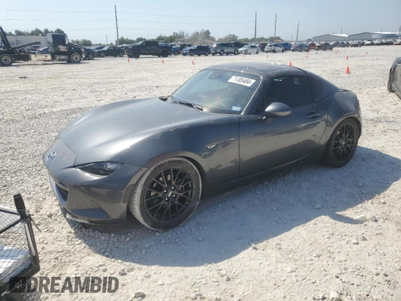 2023 Mazda MX-5 Miata Grand Touring z VIN JM1NDAM70P0550719, wystawiony jako Copart lot #75485484 z przebiegiem 21 110 mil mil oraz Szkoda całkowita • Salvage title. Historia ofert i sprzedaży dostępna na DreamBid. Obrazek 1.