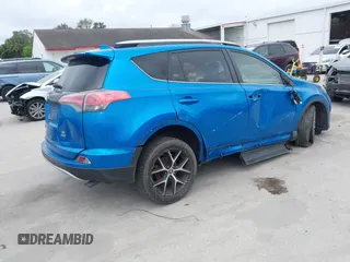 2016 Toyota RAV4 SE with VIN JTMJFREV3GJ076876, listed as a IAAI auction lot 41566899 with 133,216 mi miles and . Bid and sale history available at DreamBid. Image 4.