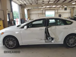 2014 Ford Fusion SE with VIN 3FA6P0HD8ER372731, listed as a IAAI auction lot 39915643 with 136,635 mi miles and . Bid and sale history available at DreamBid. Image 14.
