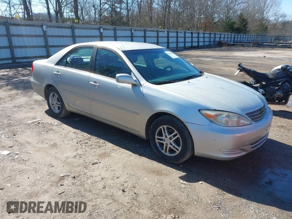 2002 Toyota Camry LE z VIN 4T1BE32K52U506649, wystawiony jako IAAI lot #41586416 z przebiegiem 312 245 mil mil oraz . Historia ofert i sprzedaży dostępna na DreamBid. Obrazek 1.