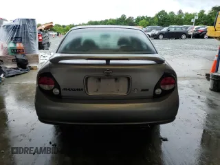 2001 Nissan Maxima SE z VIN JN1CA31A21T309782, wystawiony jako Copart lot #56696605 z przebiegiem 312 094 mil mil oraz Szkody całkowita. Historia ofert i sprzedaży dostępna na DreamBid. Obrazek 6.