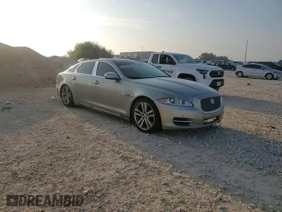 2014 Jaguar XJ Portfolio with VIN SAJWJ2GD7E8V61558, listed as a Copart auction lot 66850034 with 130,984 mi miles and Salvage title. Bid and sale history available at DreamBid. Image 10.