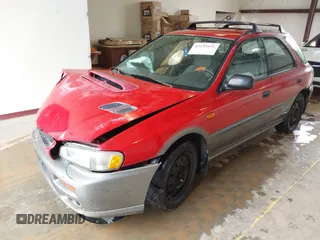 1999 Subaru Impreza Outback Special Sports z VIN JF1GF4854XH815209, wystawiony jako IAAI lot #42235555 z przebiegiem 294 867 mil mil oraz . Historia ofert i sprzedaży dostępna na DreamBid. Obrazek 2.