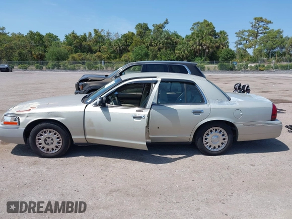 2004 Mercury Grand Marquis GS with VIN 2MEFM74W14X632470, listed as a IAAI auction lot 42120233 with 292,357 mi miles and . Bid and sale history available at DreamBid. Image 14.