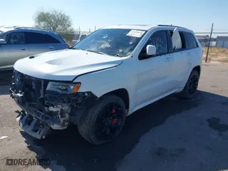 2015 Jeep Grand Cherokee SRT with VIN 1C4RJFDJ4FC122071, listed as a IAAI auction lot 41455849 with 251,476 mi miles. Bid and sale history available at carsss.com. Image 2.