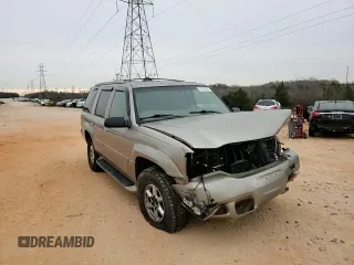 2000 Cadillac Escalade z VIN 1GYEK63R9YR218680, wystawiony jako Copart lot #87393204 z przebiegiem 295 494 mil mil oraz Szkoda całkowita • Salvage title. Historia ofert i sprzedaży dostępna na DreamBid. Obrazek 11.