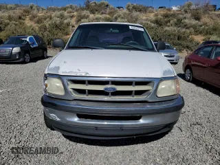 1998 Ford F-150 with VIN 1FTZX1720WKA20813, listed as a Copart auction lot 63852215 with 215,729 mi miles and Salvage title. Bid and sale history available at DreamBid. Image 5.