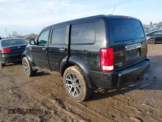 2007 Dodge Nitro SLT with VIN 1D8GT58K47W560542, listed as a IAAI auction lot 41218781 with 151,328 mi miles. Bid and sale history available at carsss.com. Image 3.