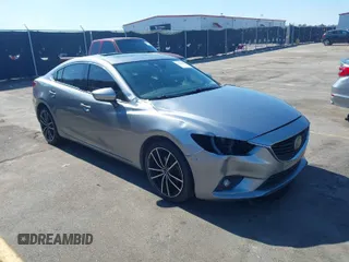 2014 Mazda 6 i Grand Touring with VIN JM1GJ1W65E1136994, listed as a IAAI auction lot 41635092 with 127,406 mi miles. Bid and sale history available at carsss.com. Image 1.