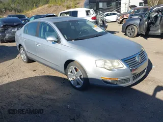 2009 Volkswagen Passat Komfort z VIN WVWJK73C69P046269, wystawiony jako IAAI lot #41700389 z przebiegiem 182 314 mil mil oraz . Historia ofert i sprzedaży dostępna na DreamBid. Obrazek 1.