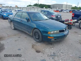 2001 Mitsubishi Diamante LS z VIN 6MMAP67P51T007599, wystawiony jako IAAI lot #42425149 z przebiegiem 115 132 mil mil oraz . Historia ofert i sprzedaży dostępna na DreamBid. Obrazek 1.