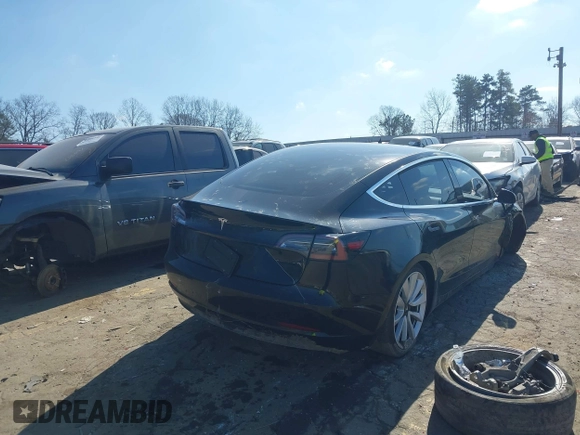 2020 Tesla Model 3 Standard Range Plus with VIN 5YJ3E1EA0LF660759, listed as a IAAI auction lot 41505250 with 63,322 mi miles and . Bid and sale history available at DreamBid. Image 4.