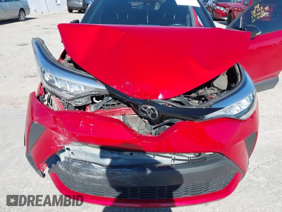 2020 Toyota C-HR LE with VIN JTNKHMBX3L1066720, listed as a IAAI auction lot 42042139 with 98,925 mi miles and . Bid and sale history available at DreamBid. Image 6.