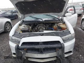 2012 Dodge Charger Police with VIN 2C3CDXAT6CH226843, listed as a IAAI auction lot 41891015 with 164,969 mi miles. Bid and sale history available at carsss.com. Image 10.