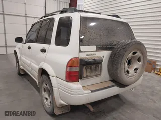 2000 Suzuki Grand Vitara JLX with VIN JS3TD62VXY4130242, listed as a IAAI auction lot 41701849 with 106,700 mi miles. Bid and sale history available at carsss.com. Image 3.