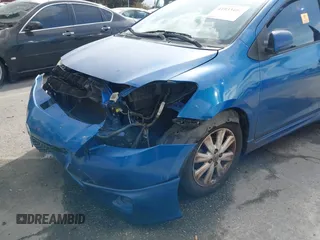 2009 Toyota Yaris with VIN JTDBT903591323255, listed as a IAAI auction lot 41933401 with 88,558 mi miles and . Bid and sale history available at DreamBid. Image 6.