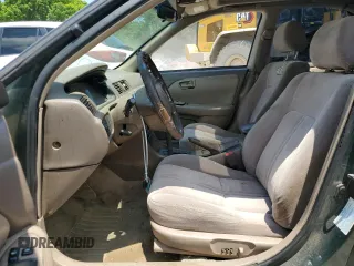 2000 Toyota Camry CE z VIN 4T1BG22K0YU708702, wystawiony jako Copart lot #56755285 z przebiegiem 318 734 mil mil oraz Szkoda całkowita • Salvage title. Historia ofert i sprzedaży dostępna na DreamBid. Obrazek 7.