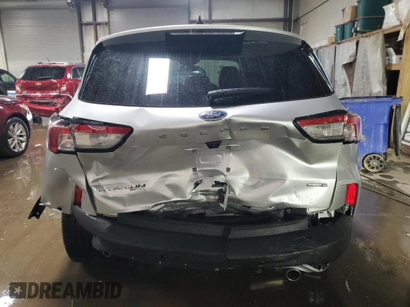 2020 Ford Escape Titanium Hybrid z VIN 1FMCU9DZ6LUB39475, wystawiony jako Copart lot #50159215 z przebiegiem 76 496 mil mil oraz Szkoda całkowita • Salvage title. Historia ofert i sprzedaży dostępna na DreamBid. Obrazek 6.