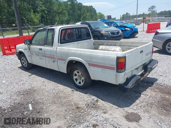 1991 Mazda B-Series Truck z VIN JM2UF3133M0169084, wystawiony jako IAAI lot #42511871 z przebiegiem 175 426 mil mil oraz . Historia ofert i sprzedaży dostępna na DreamBid. Obrazek 3.