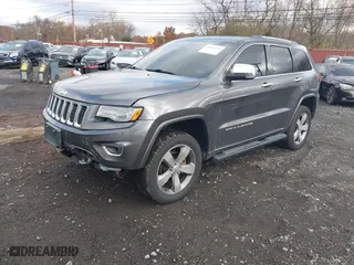 2014 Jeep Grand Cherokee Overland with VIN 1C4RJFCG5EC329377, listed as a IAAI auction lot 40822324 with 106,222 mi miles. Bid and sale history available at carsss.com. Image 2.