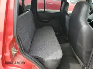 1999 Jeep Cherokee Sport with VIN 1J4FF68S3XL667570, listed as a Copart auction lot 52821105 with 173,712 mi miles and Salvage Title. Bid and sale history available at DreamBid. Image 10.