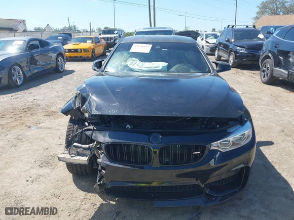 2016 BMW M4 with VIN WBS3R9C51GK708621, listed as a IAAI auction lot 41678133 with 59,501 mi miles. Bid and sale history available at carsss.com. Image 12.